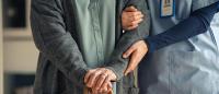 healthcare provider aiding nursing home resident